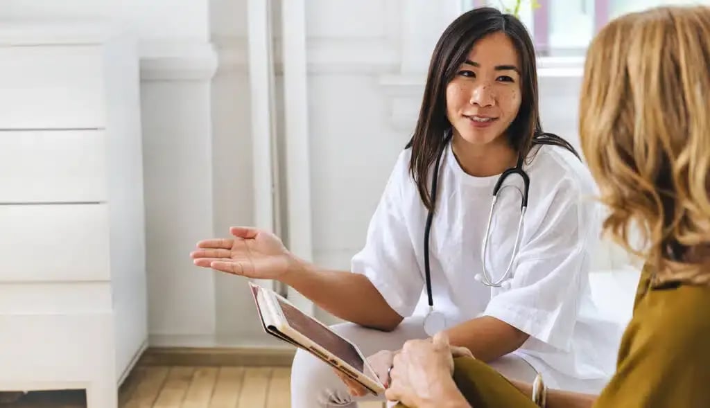 A-young-doctor-with-a-digital-tablet-device-is-explaining-the-benefits-of-neurocognitive-evaluation-to-a-patient-in-her-clinical-practice-emphasizing-patient-care-1024x589.jpg