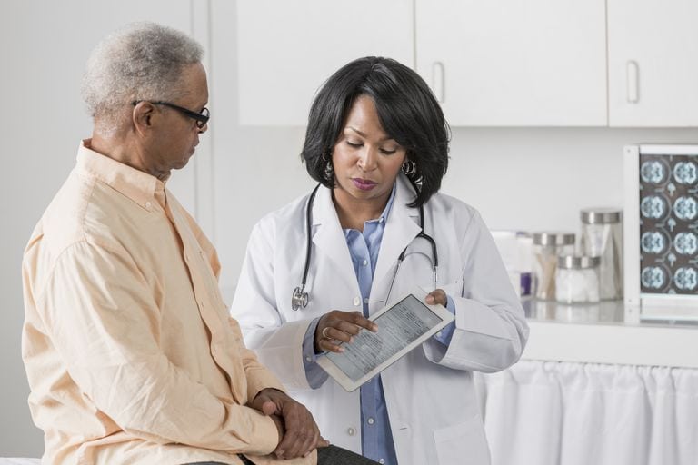 Doctor showing patient digital tablet
