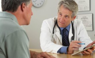 Doctor talking with patient about cognitive testing
