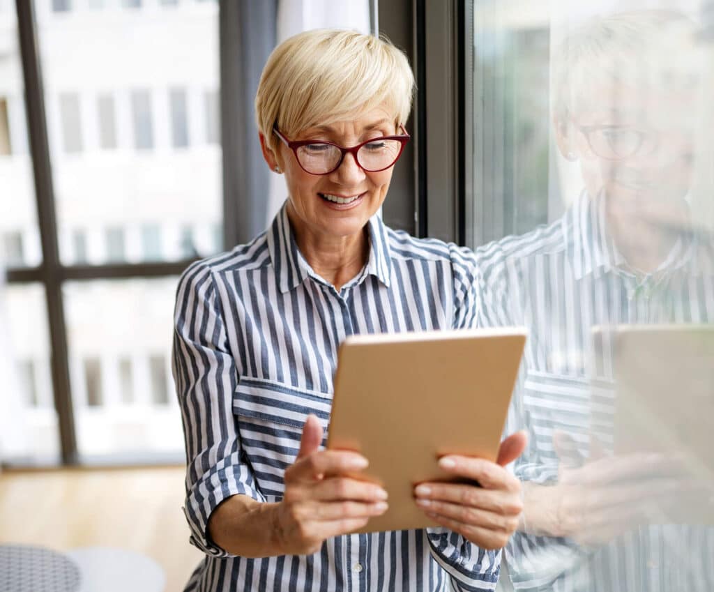 Elderly woman with tablet